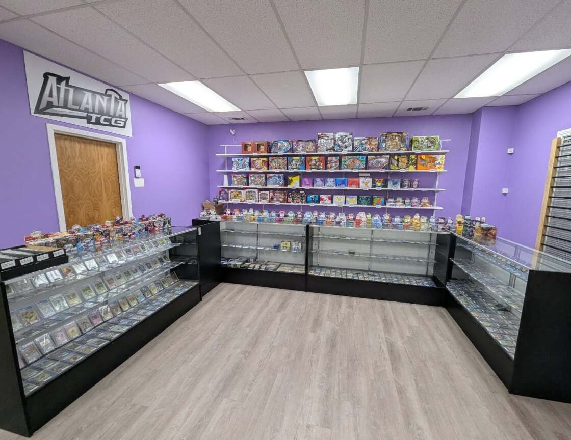 Inside the AtlantaTCG shop in Roswell, GA — display cases packed with sealed product and singles